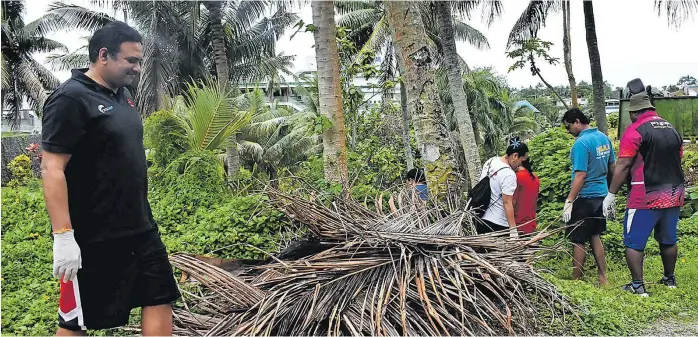  ?? Picture: ATU RASEA ?? Staff of the Fiji National Provident Fund were part of the clean-up campaign at the CWM Hospital.