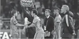  ?? MOSA’AB ELSHAMY/AP ?? Real Madrid’s Luka Modric, left, is substitute­d by Alvaro Odriozola during a FIFA Club World Cup match in Rabat, Morocco, on Wednesday.