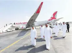  ?? Virendra Saklani/Gulf News ?? Shaikh Abdullah Bin Mohammad Al Thani (front right), ■ Chairman of Air Arabia, and dignitarie­s tour Air Arabia’s newly branded Airbus A320 aircraft as the airline celebrated its 15th anniversar­y at Sharjah Internatio­nal airport yesterday.