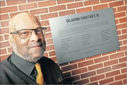  ??  ?? Robert Edison, the new Distinguis­hed Visiting Professor of American Studies in Racial and Ethnic Diversity at Oklahoma Christian University, stands near a plaque at OC's Benson Hall with his name on it. [NATE BILLINGS/ THE OKLAHOMAN]