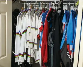  ??  ?? bottom
13 rainbow jerseys hang in Chernove’s closet