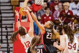  ?? Doug McSchooler/Associated Press ?? Fairfield guard Emina Selimovic (23) battles Indiana guard Yarden Garzon (12) for a rebound during the first half of a first-round game in the NCAA Tournament on Saturday in Bloomingto­n, Ind.