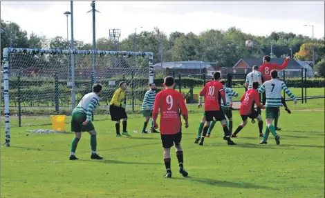  ?? Photograph­s: Marc Head ?? Leaping high into the air but Arran’s attempt at goal is unsuccessf­ul.