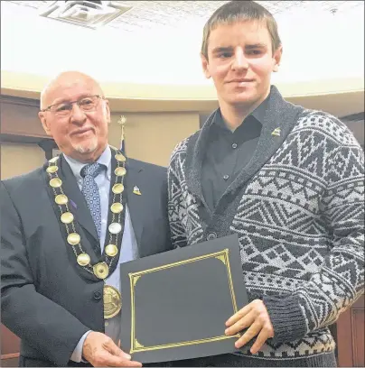  ?? COLIN MACLEAN/JOURNAL PIONEER ?? Summerside Mayor, Bill Martin, presented Dylan Corbett, with the Youth Volunteer of the Year Award during Friday’s Culture/Heritage Awards at city hall, Friday.