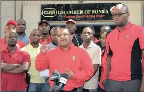  ?? PHOTO : NICHOLAS RAMA ?? NUM chief negotiater Peter Bailey (centre) addresses the media at the Chamber of Mines in Johannesbu­rg about the coal strike that, he says, will end soon.