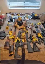  ?? U.S. ATTORNEY FOR THE MIDDLE DISTRICT OF TENNESSEE VIA AP ?? An evidence photo shows assault rifles found during a search of Eric Munchel’s home.