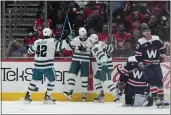  ?? JESS RAPFOGEL — THE ASSOCIATED PRESS ?? San Jose Sharks left wing Evgeny Svechnikov (10) celebrates with left wing Jonah Gadjovich (42) and center Logan Couture (39) after scoring against the Washington Capitals during the first period of a game on Sunday, in Washington.