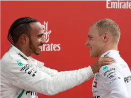  ?? Picture: AP PHOTO ?? WE DID GOOD, PARTNER: Mercedes driver Lewis Hamilton, left, celebrates with second-placed Valtteri Bottas after winning the German Grand Prix.