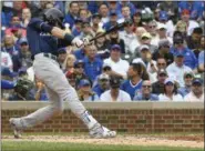  ?? MATT MARTON - THE ASSOCIATED PRESS ?? Milwaukee Brewers’ Christian Yelich (22) hits an RBI single during the third inning of a tiebreak baseball game against the Chicago Cubs on Monday, Oct. 1, 2018, in Chicago.