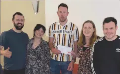  ?? ?? LEFT: Dermot O’Donovan MLTC presenting the winning team with their prize, quiz Stephen Murphy, Angela Crowley, Elsie Ronan and Steve Dennehy.