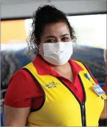  ?? PHOTO COURTESY OF WALMART ?? Walmart this week paid out another $180million in bonuses to its employees across the county — $6.4million in Pennsylvan­ia. It was the second bonus payment this month. This photo shows a Walmart employee wearing a mask and gloves.