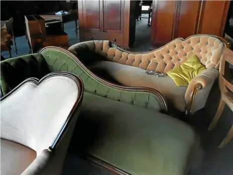  ?? Photos: Bev Lacey ?? These antique lounge chairs will form part of the huge auction of furniture and antique collectabl­es to be held at the Toowoomba Turf Club next Sunday (October 21).