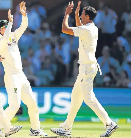  ?? Pictures: Getty. ?? Left: Jonny Bairstow becomes the final England wicket to fall; above: Mitchell Starc goes to celebrate with Usman Khawaja and Cameron Bancroft after clinching victory for Australia.