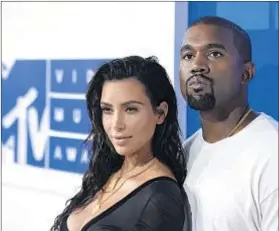  ?? Evan Agostini Associated Press ?? KIM KARDASHIAN and Kanye West this year moved into their mansion, whose renovation cost $20 million.