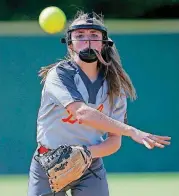  ?? BY SARAH PHIPPS, THE OKLAHOMAN] [PHOTO ?? Danyn Lang of Dale throws to first base during Thursday’s state fast pitch softball tournament at FireLake Ball Fields in Shawnee. Dale advanced with a win over Colbert.