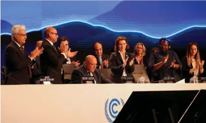  ?? Photograph: Mohamed Abd El Ghany/Reuters ?? Delegates applaud as Cop27 president Sameh Shoukry delivers a statement during the closing plenary at the climate summit in Red Sea resort of Sharm el-Sheikh on Sunday.