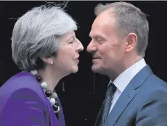  ??  ?? Theresa May greets Donald Tusk at 10 Downing Street yesterday