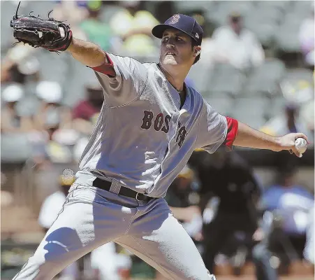  ?? AP PHOTO ?? ANOTHER SHORT DAY: Red Sox starter Drew Pomeranz delivers a pitch against the Athletics during his fourinning outing yesterday in Oakland, Calif.