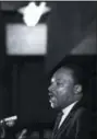  ?? CHARLES KELLY — THE ASSOCIATED PRESS FILE ?? In this file photo, Dr. Martin Luther King Jr. makes his last public appearance at the Mason Temple in Memphis, Tenn. The following day King was assassinat­ed on his motel balcony.