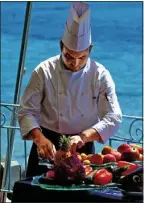  ??  ?? FINE DINING: One of the Forte Village Resort’s chefs prepares lunch