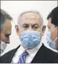  ?? Ronan Zvulun Associated Press ?? NETANYAHU and all others in the courtroom had to wear face masks amid the pandemic.