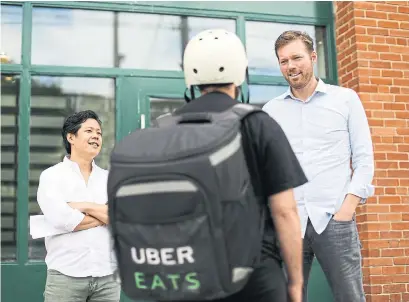  ?? RANDY RISLING/TORONTO STAR ?? Head of UberEveryt­hing Jason Droege, right, said data has shown food delivery is more popular than ride-share in some places.