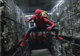  ??  ?? This image released by Columbia Pictures shows Tom Holland in a scene from “SpiderMan: Homecoming.” CHUCK ZLOTNICK — COLUMBIA PICTURES-SONY VIA AP