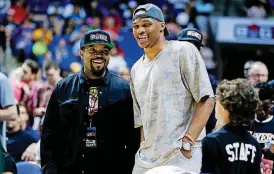  ?? [PHOTO BY JESSIE WARDARSKI, TULSA WORLD] ?? Russell Westbrook, right, talks with BIG3 founder Ice Cube at the three-on-three league’s stop at BOK Center in Tulsa on Sunday.