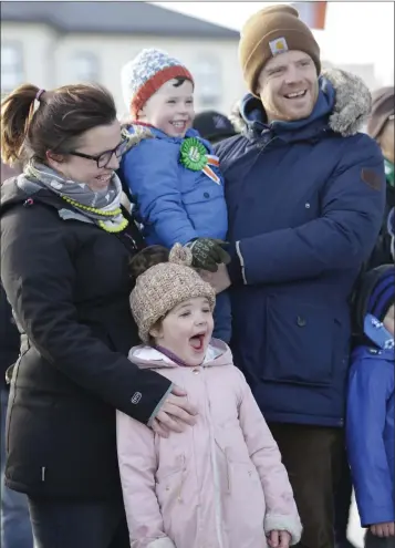  ??  ?? Patricia, Julianne, Bobby and Ian Shortt watching the fire baton juggling at the bandstand in Bray during the St Patrick’s Festival.