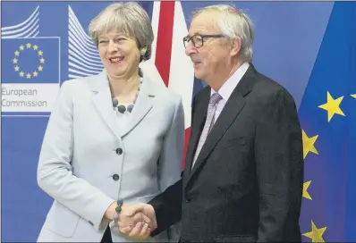  ?? PICTURE: AP PHOTO/VIRGINIA MAYO. ?? SHAKE ON IT: British Prime Minister Theresa May with European Commission President Jean-Claude Juncker yesterday.