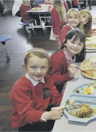  ??  ?? Primary one children at the Royal High Primary School in Edinburgh tuck into their dinner on Meat Free Monday