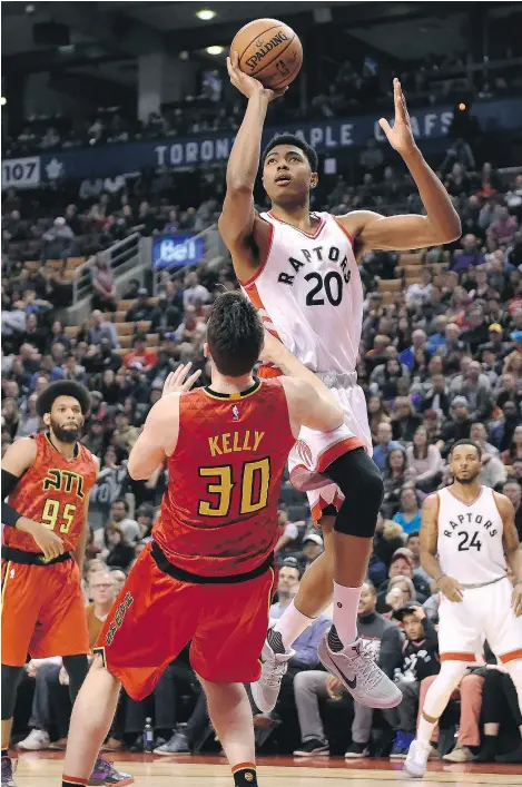  ?? — THE CANADIAN PRESS ?? Toronto Raptors forward Bruno Caboclo drives against Atlanta Hawks forward Ryan Kelly during the Raptors’ 128-84 eviscerati­on of the Hawks on Saturday at the Air Canada Centre in Toronto.