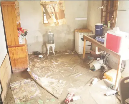  ??  ?? The kitchen of a Stewartvil­le house after the water receded yesterday.