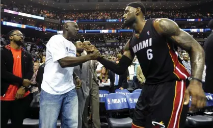 ?? Photograph: Charlotte Observer/ MCT via Getty Images ?? Michael Jordan and LeBron James greet each other during James’s time with the Miami Heat in 2014.