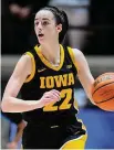  ?? Michael Conroy/Associated Press ?? Iowa guard Caitlin Clark dribbles against Purdue during the first half on Jan. 10.