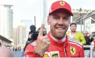  ?? AFP ?? Ferrari’s Sebastian Vettel celebrates his pole position following the qualifying session for the Azerbaijan Grand Prix. —
