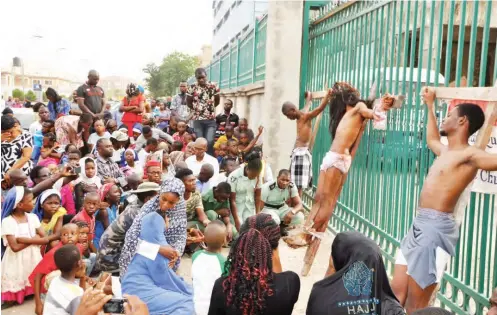  ?? Parishione­rs of Our Lady Queen of Peace Catholic Church Utako celebrate Passion of Christ to mark Good Friday in Abuja yesterday Photo: Ikechukwu Ibe ??