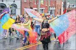  ??  ?? Seriously, I dare you not to have fun at a Pride parade, these belly dancers appear to say.