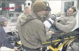  ?? WCAX-TV CHANNEL 3VIA AP ?? A U.S. Army soldier is evacuated on a stretcher following an avalanche Wednesday. Six U.S. soldiers were injured while participat­ing in U.S. Army mountain-wartime training near Easy Gully in Smugglers Notch, a narrow pass at the edge of Mount...