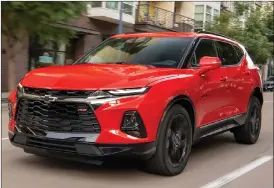  ?? Associated Press photos ?? The Chevrolet Blazer, above left, and Honda Passport were put through the paces by Edmunds in a head-to-head test.