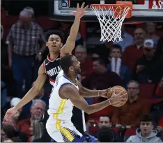  ?? CRAIG MITCHELLDY­ER — THE ASSOCIATED PRESS ?? Warriors guard Alec Burks, right, could be a coveted scorer off the bench at the upcoming trade deadline. But the Warriors want to keep him for the future.