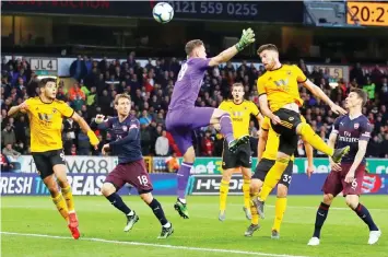  ??  ?? Wolverhamp­ton Wanderers’ Matt Doherty (second right) scores their second goal during the English Premier League match against Arsenal at the Molineux stadium in Wolverhamp­ton, central England. — Reuters photo