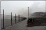  ?? ORVIL SAMUEL — THE ASSOCIATED PRESS ?? A road is blanketed in volcanic ash April 10 at the internatio­nal airport in Kingstown, on the eastern Caribbean island of St. Vincent due to the eruption of La Soufriere volcano.