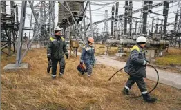  ?? Evgeniy Maloletka Associated Press ?? POWER PLANT workers have helped Ukraine’s homes stay heated this winter amid Russian bombardmen­ts on its energy system. “We have no fear,” one said.