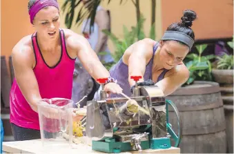  ?? PHOTOS: CTV/BELL ?? Kristen Mckenzie, left, and Steph Leclair compete in the sugar cane challenge in the Museo del Ron Havana Club (The Havana Club Museum of Rum) during the Cuban leg of The Amazing Race Canada. They must grind enough sugar cane extract to fill a vat, mix...