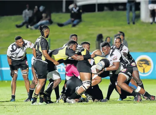  ?? Picture: SIBONGILE NGALWA ?? NO LETTING UP: University of Fort Hare Blues and Walter Sisulu University All Blacks throw everything into a loose maul at the BCM Stadium on Monday night