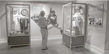  ?? Karen Warren / Houston Chronicle ?? A visitor takes a photo of the Bud Selig exhibit, which is next to the Jeff Bagwell exhibit inside the Hall of Fame. Bagwell and Selig will be inducted into the shrine together, with 1994 a key season in both legacies.