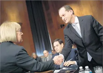  ?? Win McNamee Getty Images ?? SEN. PATTY MURRAY (D-Wash.), left, greets Labor secretary nominee R. Alexander Acosta before his confirmati­on hearing. Democrats pressed Acosta about his record as a Justice official and federal prosecutor.