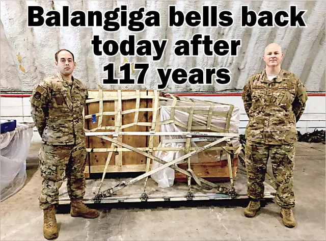  ??  ?? BALANGIGA BELLS BACK TODAY – The historic Balangiga bells are all set to return today to the Philippine­s from the United States 117 years after American soldiers seized them from Balangiga town in Eastern Samar as war memorial. In this photo, two American soldiers stand guard in front of the Balangiga bells, now in crates, at the Kadena Air Base in Okinawa, Japan, while en route to the Philippine­s. (Courtesy of the Embassy of the United States in Manila)