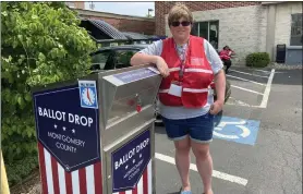  ?? EVAN BRANDT — MEDIANEWS GROUP ?? Nichole Holland was on hand to keep an eye on the ballot drop off box at the Montgomery County Health Department office on King Street in Pottstown.